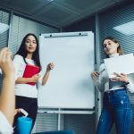 Women communicate during briefing coaching